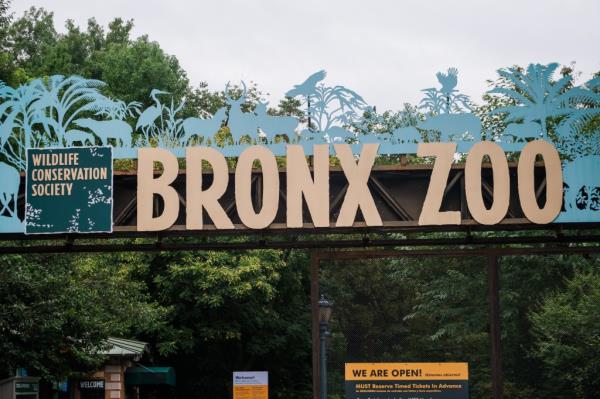 A sign reads "We Are Open!" at the entrance to the Bronx Zoo in the Bronx borough of New York, U.S., on Friday, July 24, 2020